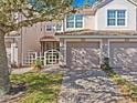 Charming townhome featuring a two-car garage and inviting curb appeal in a manicured community at 8338 Quimby Cir, Davenport, FL 33896