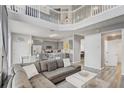 Spacious living room boasts an open layout and seamless flow into kitchen, ideal for entertaining at 1028 Orange Cosmos Blvd, Davenport, FL 33837