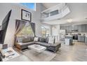 Open concept living area featuring abundant natural light, modern furnishings, and flowing design at 1028 Orange Cosmos Blvd, Davenport, FL 33837