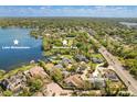 Stunning aerial view showcasing the property's proximity to Lake Minnehaha and Minnehaha Park at 111 Woodstream Ct, Maitland, FL 32751