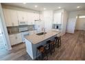 Modern kitchen featuring white cabinets and a center island with seating at 13233 Lake Yale View Loop, Grand Island, FL 32735