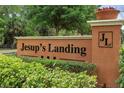 Jesup's Landing entrance sign surrounded by lush greenery at 1341 Mill Stream Ln, Winter Springs, FL 32708