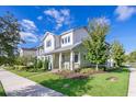 Beautiful two-story home featuring a cozy porch and well-maintained lawn at 13852 Maskawa Ave, Orlando, FL 32827