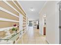 Inviting foyer with tile flooring and decorative wall trim, leading to an open living space at 1400 Moon Valley Dr, Davenport, FL 33896