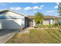 Well-maintained home exterior features a charming front porch with a white garage door at 3121 Heartwood Ave, Winter Park, FL 32792