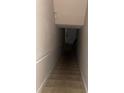 A stairwell featuring neutral colors, a sturdy handrail, and a door at the bottom at 8843 Villa View Cir # 14-205, Orlando, FL 32821