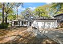 Charming single-story home with mature trees, well-maintained landscaping, and a two-car garage at 942 Cinnamon Ct, Altamonte Springs, FL 32714