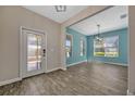 Bright entryway with stylish tile floors, complemented by neutral and blue-toned walls at 11880 Sonnet Ave, Orlando, FL 32832