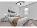 Comfortable bedroom featuring a plush bed, neutral decor, and a large window at 1232 Celery Oaks Ln, Sanford, FL 32771