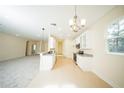 Bright kitchen featuring white cabinets, stainless steel appliances, and a tile backsplash at 1447 Kissimmee Way, Kissimmee, FL 34759