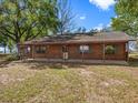 Cozy log home with a covered porch, perfect for enjoying peaceful outdoor living at 16510 Quarter Horse Ct, Montverde, FL 34756