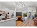 Bright living room featuring vaulted ceilings, modern lighting, and stylish decor at 1756 Waterbeach Ct, Apopka, FL 32703