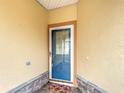 Inviting front entrance with a glass-paneled door and decorative welcome mat at 253 Lake Cassidy Dr, Kissimmee, FL 34759