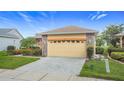 Beautiful single-Gathering home with a manicured lawn and welcoming curb appeal at 253 Lake Cassidy Dr, Kissimmee, FL 34759