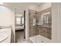 Bathroom showcasing a tiled glass shower and access to the main bedroom at 3242 Irish Peach Dr, Winter Garden, FL 34787