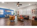 Spacious living area with dining space, a comfortable seating arrangement, and views of the outdoors at 3242 Irish Peach Dr, Winter Garden, FL 34787