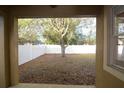 View of the expansive backyard featuring white vinyl fence from covered patio at 4852 Blue Major Dr, Windermere, FL 34786