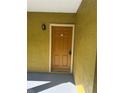 A condo front door with unit number 303 and a secure digital lock at 5271 Images Cir # 303, Kissimmee, FL 34746