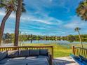 Scenic lake view from the deck with outdoor seating, perfect for enjoying serene waterfront living at 668 Lake Villas Dr # 668, Altamonte Springs, FL 32701