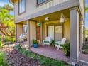 Inviting porch with seating and plants, offering a relaxing outdoor space to enjoy the scenery at 668 Lake Villas Dr # 668, Altamonte Springs, FL 32701