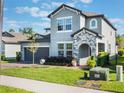 Charming two-story home featuring a well-manicured lawn, brick driveway, and attached two-car garage at 753 Daybreak Pl, Longwood, FL 32750