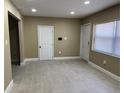 Open-concept living room featuring neutral paint, recessed lights, and tile flooring at 1121 Santa Anita St, Orlando, FL 32808