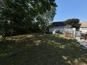 Wide backyard with large mature tree, perfect for entertaining or relaxing in the outdoors at 1233 Hancock Cir, St Cloud, FL 34769