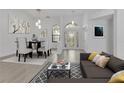 Stylishly decorated living room featuring modern furniture, hardwood floors, and an abundance of natural light at 1510 Wescott Loop, Winter Springs, FL 32708