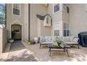 This cozy patio is decorated with outdoor furniture, plants, and other decorations at 1570 Farrindon Cir, Lake Mary, FL 32746