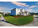 Beautiful two-story home featuring a green lawn and low-maintenance landscaping at 2313 Ivy Harvest Pl, Oviedo, FL 32765