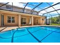 Enjoy the outdoors with this property's refreshing screened-in pool and covered patio at 4393 S Devon Ct, Kissimmee, FL 34746