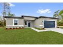 Charming single-story home featuring a well-maintained lawn and a two-car garage at 531 Marion Oaks Blvd, Ocala, FL 34473