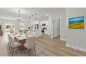 Open-concept living space featuring dining area, kitchen, and sliding glass doors to backyard at 531 Marion Oaks Blvd, Ocala, FL 34473