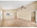 Inviting living room with high ceilings, tile flooring, and abundant natural light at 605 Swallow Ct, Apopka, FL 32712