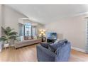 Bright and airy living room with vaulted ceilings and a large window, offering plenty of natural light at 782 Seneca Meadows Rd, Winter Springs, FL 32708