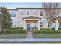 Charming townhome with a well-maintained front yard and a cozy porch area at 9743 Amber Chestnut Way, Winter Garden, FL 34787