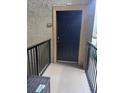 Front door entrance with a railing for unit #220 at 102 Vista Verdi Cir # 220, Lake Mary, FL 32746