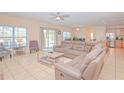 Bright living space featuring tile floors, neutral paint, and an open layout perfect for entertaining at 1040 Andalusia Loop, Davenport, FL 33837