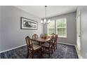 Cozy dining room with a stylish light fixture and ample natural light at 1169 Orange Ave, Winter Springs, FL 32708