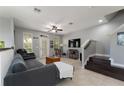 Bright living room with tile floors, a ceiling fan, and access to the front porch at 1169 Orange Ave, Winter Springs, FL 32708