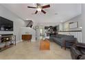 Inviting living room featuring tile floors, a ceiling fan, and an open floor plan at 1169 Orange Ave, Winter Springs, FL 32708