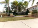 Attractive community sign set among palm trees and manicured landscaping for a welcoming entrance at 1285 S South Beach Circle Cir, Kissimmee, FL 34746