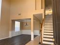 Bright living room with high ceilings, decorative chandelier, and elegant wainscoting detail at 13422 Exbury Ln, Windermere, FL 34786