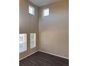 Spacious room with high ceilings and multiple windows, featuring modern flooring and ample natural light at 13422 Exbury Ln, Windermere, FL 34786