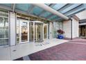Elegant building entrance featuring a revolving door under a glass awning at 150 E Robinson St # 1007, Orlando, FL 32801