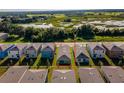 Birds eye view of house with neutral gray roofing and ample yard space on all sides at 2464 Ribbon Fall Ave, Davenport, FL 33837