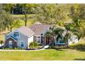 Beautiful single-Gathering home with well-maintained landscaping, stone accents, and a welcoming entrance at 25249 Derby Dr, Sorrento, FL 32776
