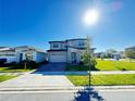 Charming two-story home features manicured lawn and landscaping in a Gathering-friendly neighborhood at 2861 Willowseed Ln, St Cloud, FL 34772