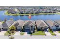 Stunning aerial view of home in lakeside community, showcasing its prime location and neighborhood at 3018 Jardin St, Kissimmee, FL 34741