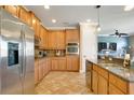 Bright kitchen with granite countertops, stainless steel appliances, and ample cabinet space at 3890 Mcguirk Ct, Oviedo, FL 32766